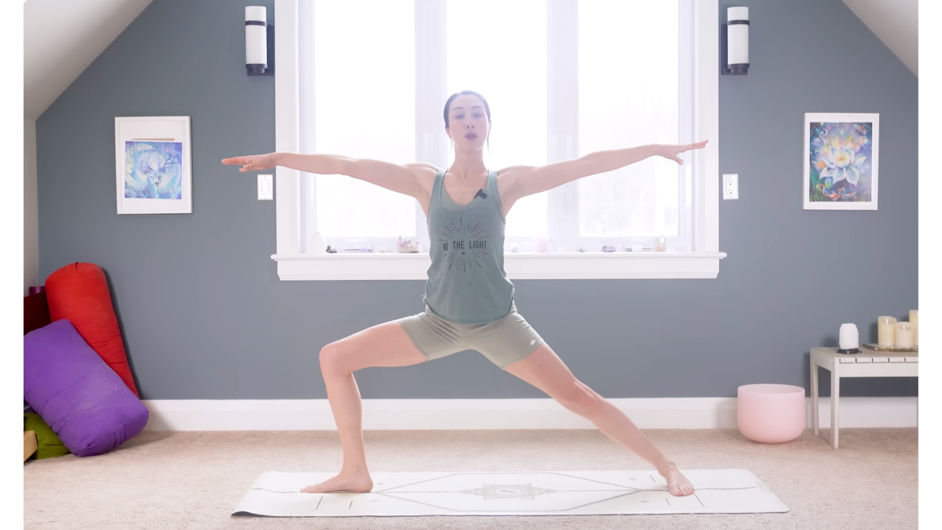 Woman in Warrior 2 on a mat